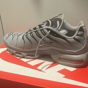 Grey and black Nike air max plus